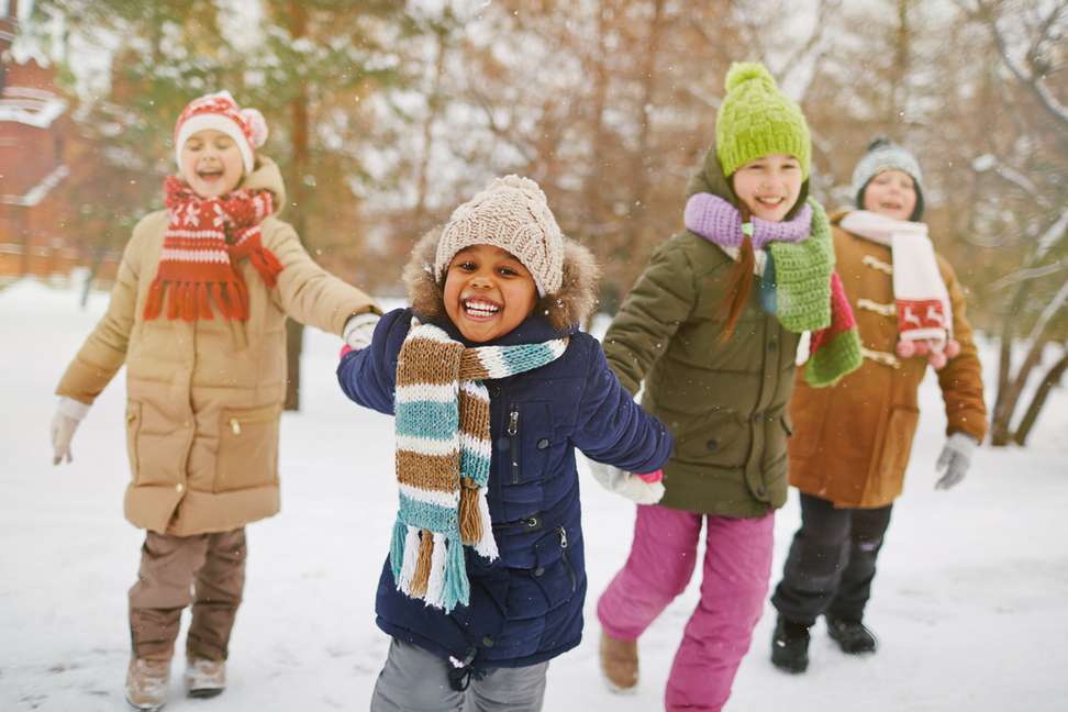 children playing outside in snow